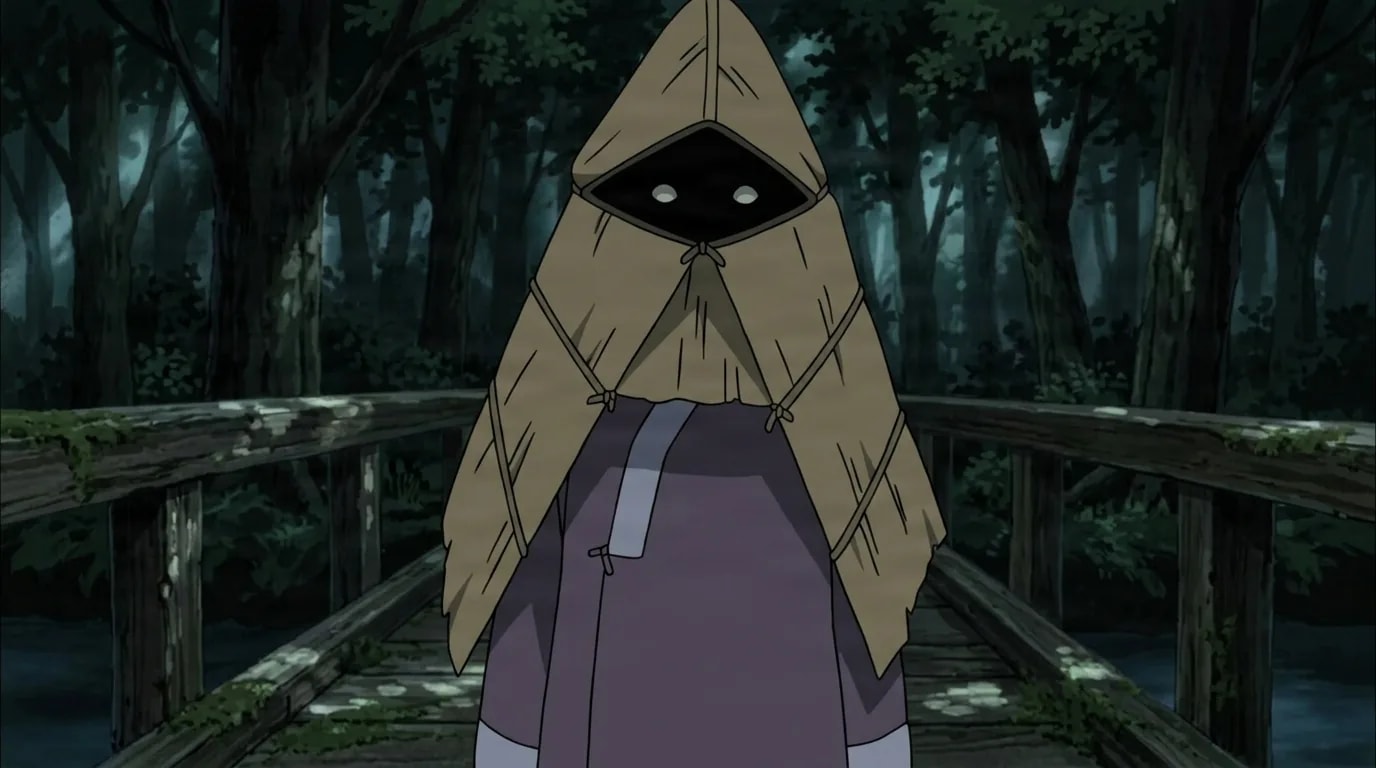 A small figure hidden under a woven straw cloak stands on a dark wooden forest bridge, two pale eyes glowing from the shadowed face.