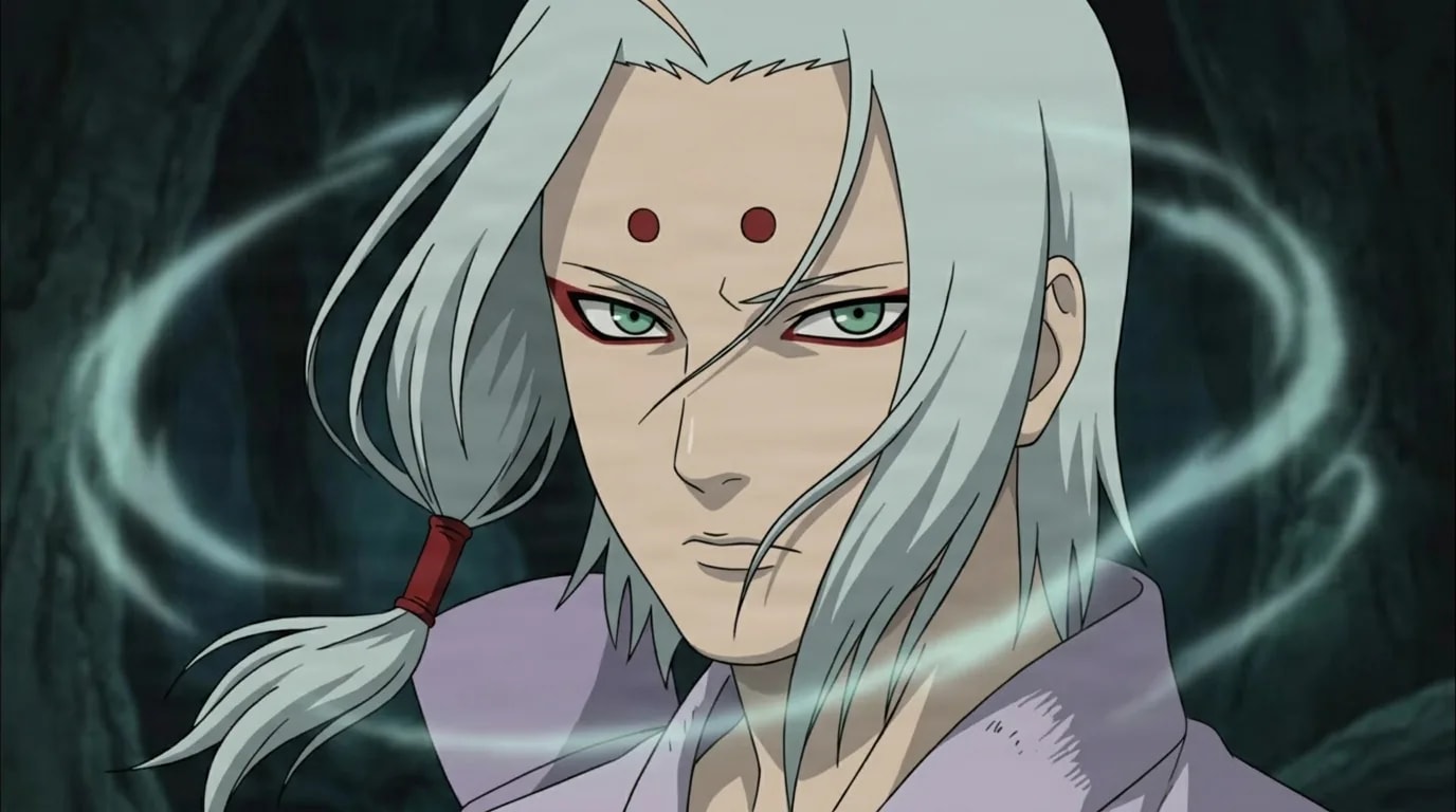 A pale silver-haired young man with two red dots on his forehead and red-rimmed green eyes stares coldly forward while faint glowing rings of energy swirl around him against a dark background.